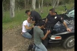 A pair of cops fucks two detained boys on a forest road - gay porn