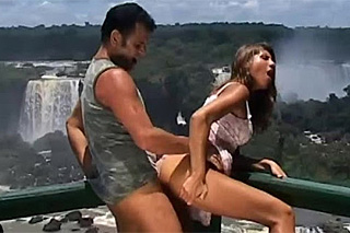 Lovers are fucking by the waterfall
